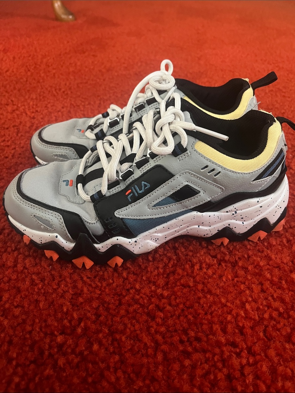 FILA Womens Gray and Black Trail Sneakers with Orange Accents